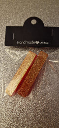 Duo de pinces à cheveux – Rouge et or pailleté